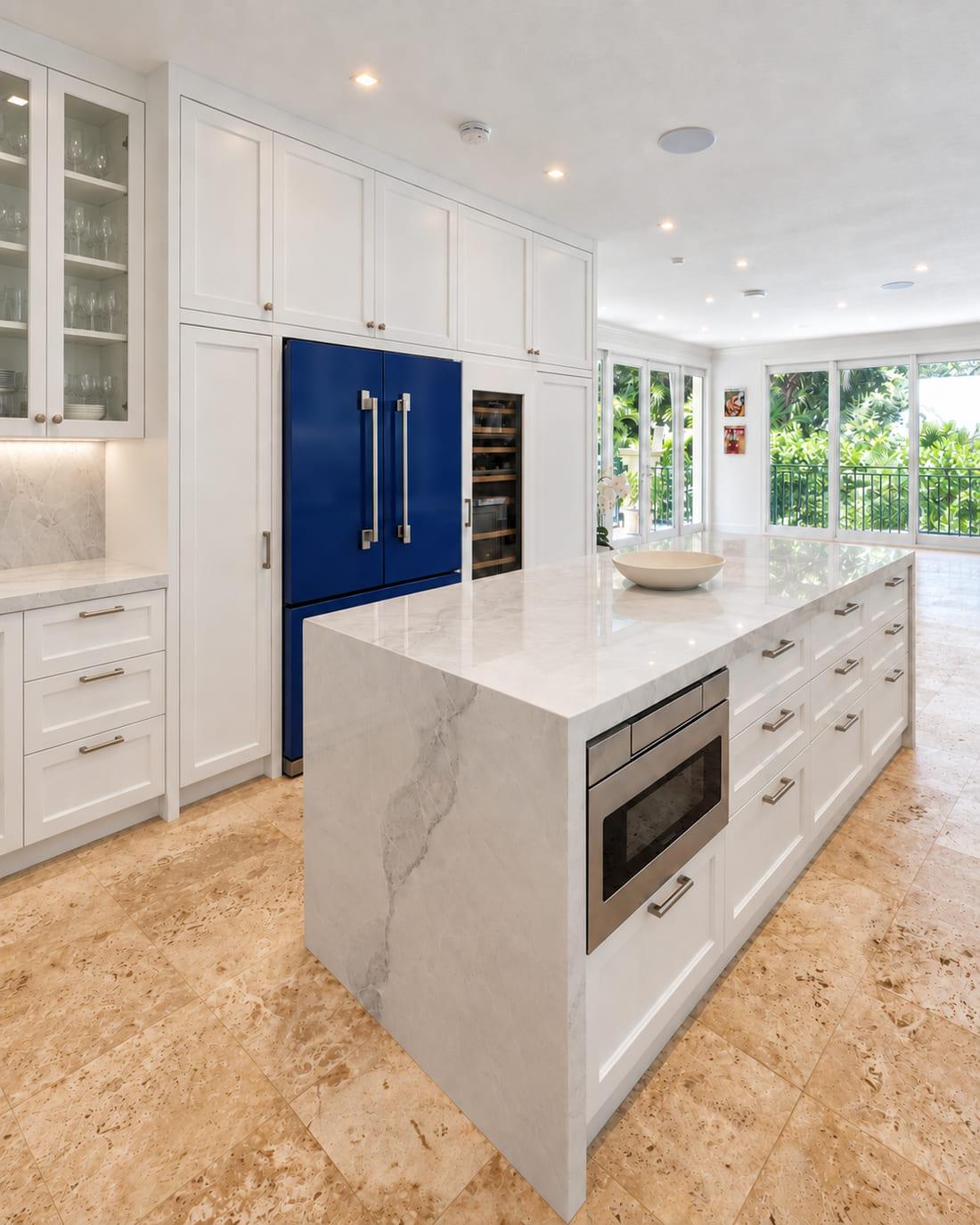 Panelled fridge and glass-fronted wine cabinet in a kitchen run