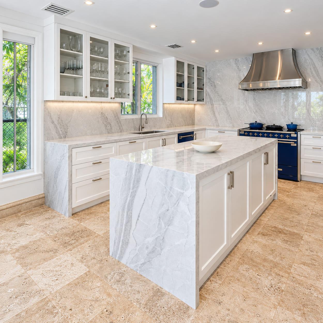 The window wall opened up: sink run, marble counter and glass-fronted cabinets