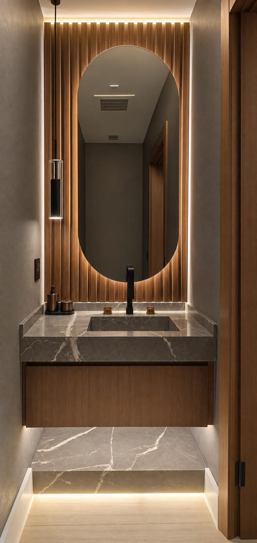 Powder room with a carved stone basin on a floating walnut vanity