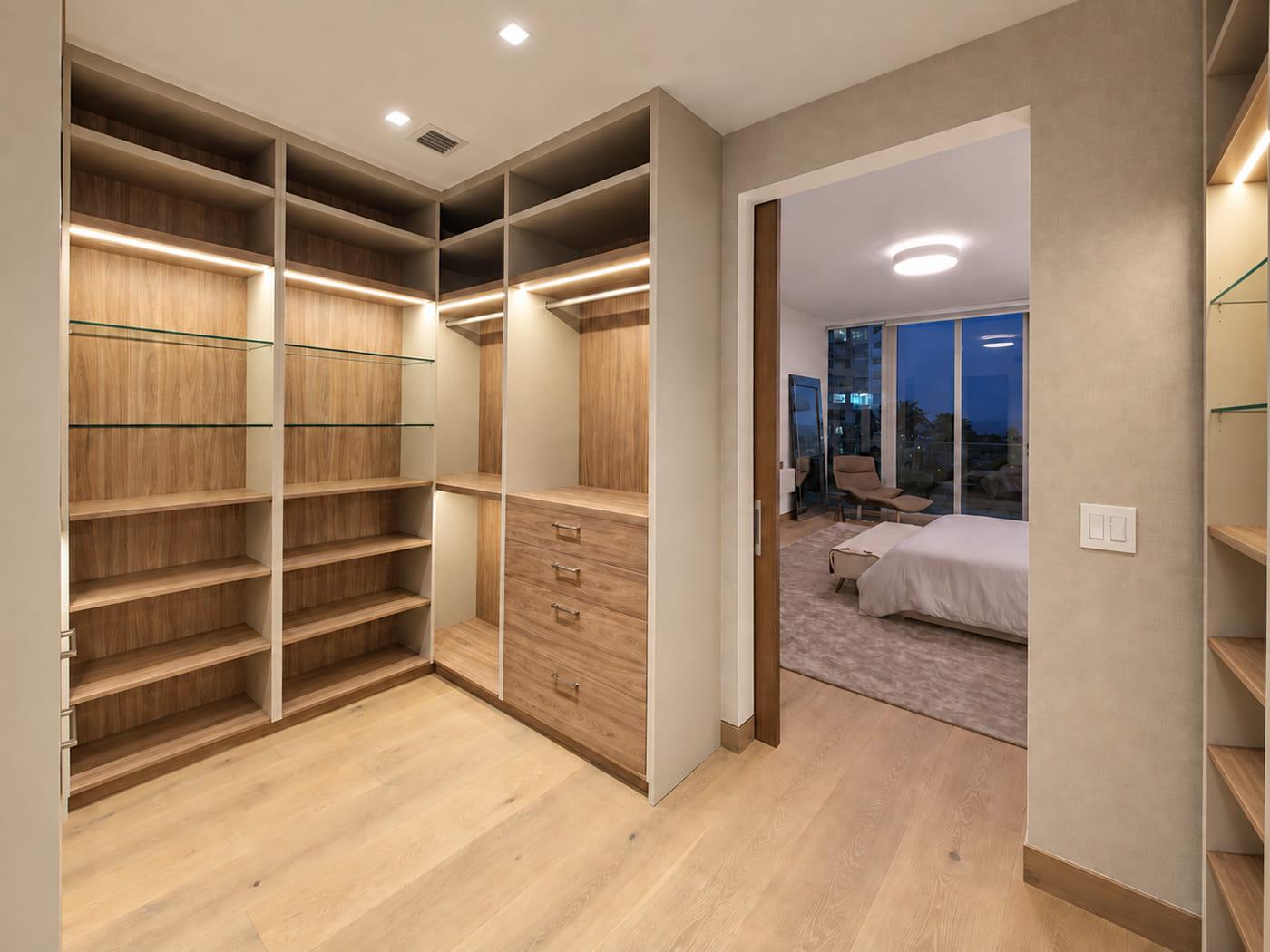 Corner of the oak dressing room with the bedroom and the bay through the opening